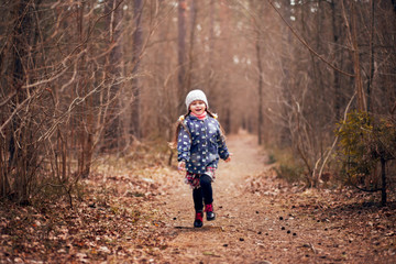 little cute girl in the spring forest
