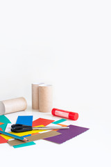Color cardboard trim, pencil, scissors, glue and empty toilet rolls. Set for applique. Activities...