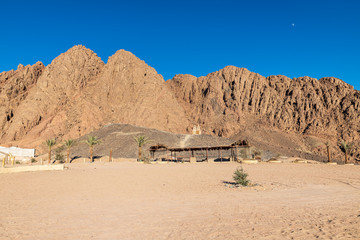 Fototapeta na wymiar Arid mountains in the desert area of southern Sinai near to Sharm El-Sheikh during a safari tour (Egypt).