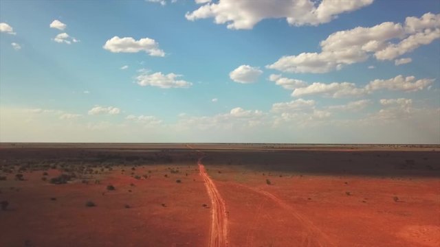 Remote dirt track across Australian desert