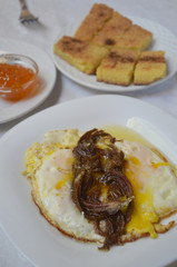 Fried egg with Dried meat Khlea (or khlii) in Morocco. traditional Moroccan breakfast with harcha bread.