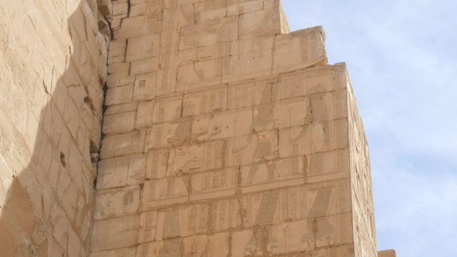 Remnants of the Wall in the Temple. There Are Very Well Preserved Drawings and Murals of Pharaohs Who Ruled Over Egypt on the Wall. This Wall was Made of Yellow Stones in a Form of Bricks.
