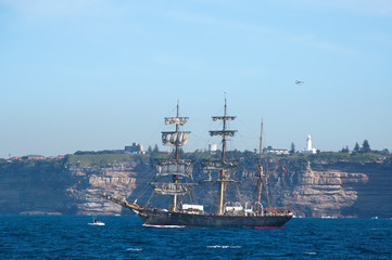 Sydney Australia, Schooner with Macquarie lighthouse on Dunbar Head in the background