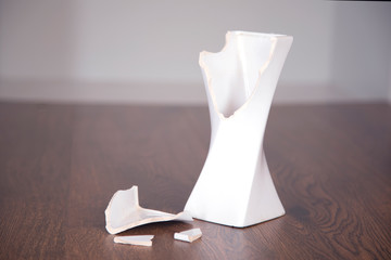 broken vase on table