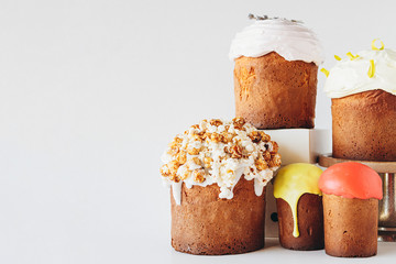 Modern stylish easter pies with toppings, festive composition in rustic style in white background