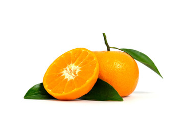 Half sliced and raw of Citrus sinensis ( called jeruk baby santang ) with leaves – local fresh fruit from Indonesia. Isolated fruit on a wooden basket / bowl