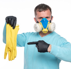 Man in respirator and gloves showing on protective gloves over white background