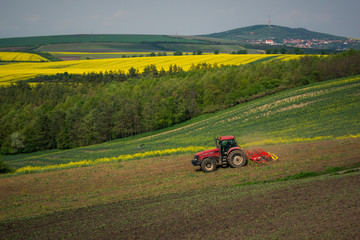 Tractor in the moravian field at spring near Karlin, Chech Republic