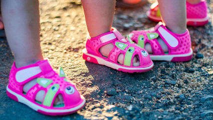 female feet in pink shoes