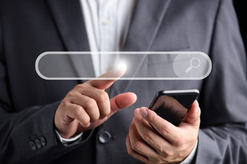 Hand man using smartpone for Searching Browsing Internet Data Information Networking Concept.