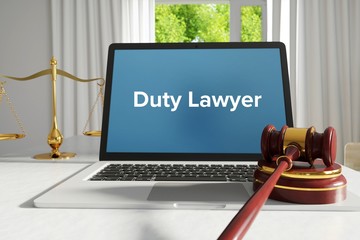 Duty Lawyer – Law, Judgment, Web. Laptop in the office with term on the screen. Hammer, Libra, Lawyer.