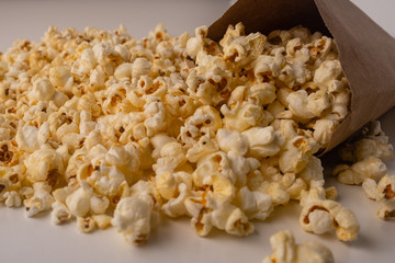 Heap of delicious popcorn on the white background.