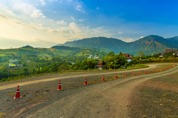 Fototapeta premium Landscape view of big white Buddha statue at Wat Phra That Pha Son Kaew Temple with mountain view background at Khao Kho, Phetchabun ,Thailand