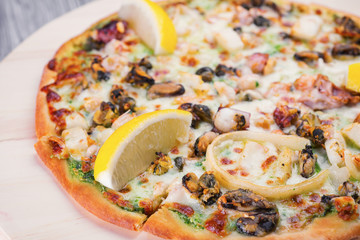 Pizza with cheese and lemon