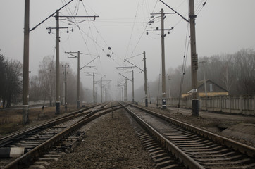 Fototapeta na wymiar railway in the morning fog