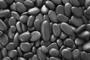 Close up natural black grey pebbles, texture of decorative stone gravel for background and design.