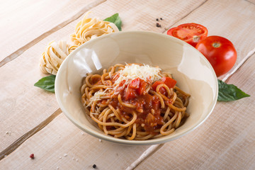 Paste with cheese and tomatoes in the restaurant