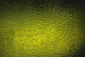 Texture water drops on the bottle of beer. Beer background,Water droplets on the green background for cool and fresh texture