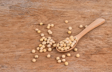 Soybeans on a wooden spoon, placed on a wooden