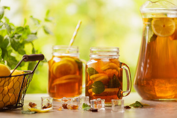 Iced tea with lemon and ice cubes