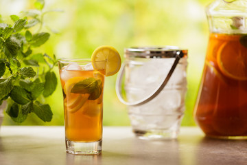 Iced tea with lemon and ice cubes