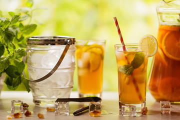 Iced tea with lemon and ice cubes