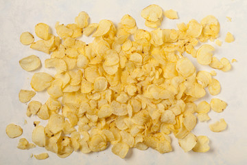 Background made of chips, prays and/or popcorn. Top view.