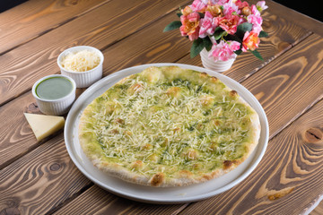 Delicious pizza with cheese, olives and greens