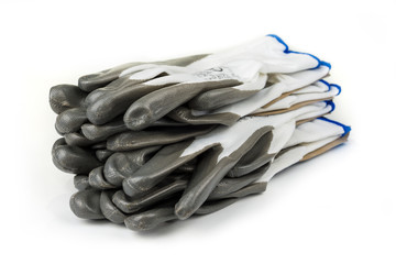 Stack of  new working gloves on a white background