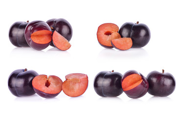 Prunes fruit on white background.