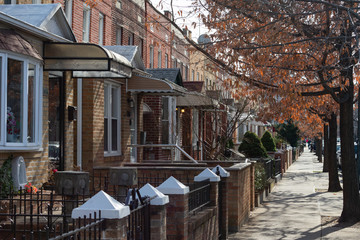 A Row of Old Brick Homes along the Sidewalk in Astoria Queens of New York City