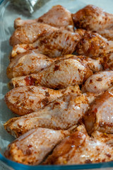 closeup view of raw marinated chicken legs
