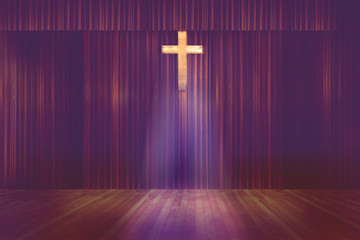 wooden cross on red curtain background in small church