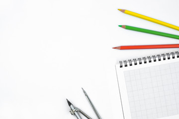 Study materials containing different color pencil,a pencil compass attached to a pencil and a diary