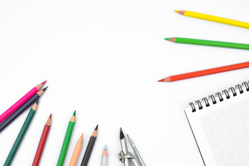 Study materials containing different color pencil,a pencil compass and a diary