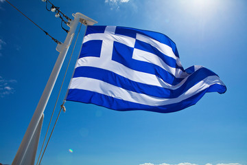 Greek Flag against a blue sky