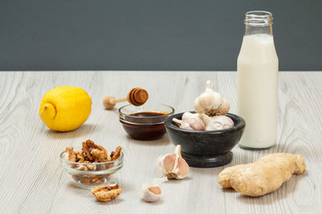 Health remedy relief foods for cold and flu on a gray wood boards.