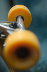 yellow skateboard wheels on blue background