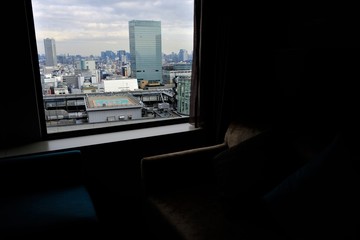 Fototapeta na wymiar ホテルの窓から見える都会の風景