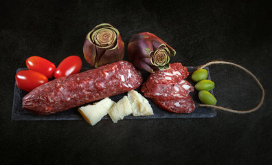 parmesan, olives, artichokes, mea, snack, plate, catered, serving, variety, event, dish, closeup, celebration, prosciutto, cuisine, appetite, luxury,  fresh, caviar, goose liver, catering, service, 
