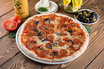 Delicious pizza with cheese, tomatoes and olives