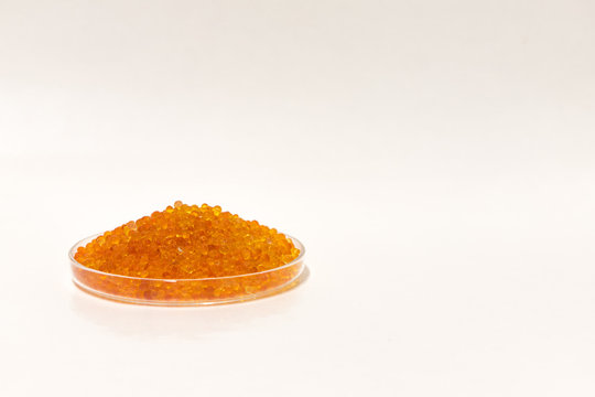 Silica Gel Dessicant In A Dish On A White Background