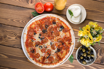 Delicious pizza with cheese, tomatoes and olives