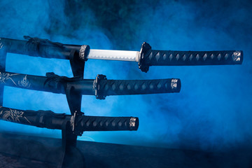 Stand with swords, one partially exposed
