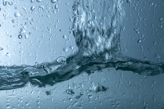 water splash with reflection, isolated on white background. © Thaweekiat