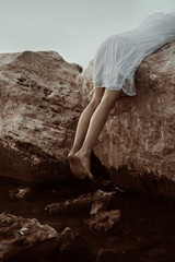 Woman in the sea with white dress 