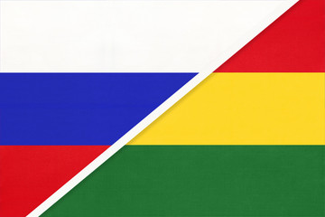 Russia vs Bolivia national flag from textile. Relationship and partnership between two countries.