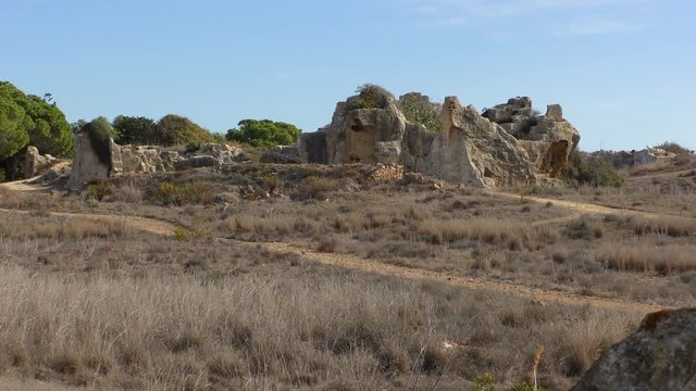 Destroyed walls of the ancient necropolis "Royal Tombs", near Paphos, Cyprus.