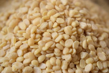 Split White Urad Dal. Vigna mungo Beans as an abstract background texture