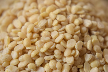 Split White Urad Dal. Vigna mungo Beans as an abstract background texture